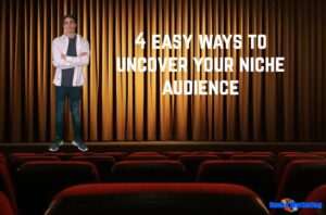 Man presenting "4 Easy Ways to Uncover Your Niche Audience" in an empty theater.