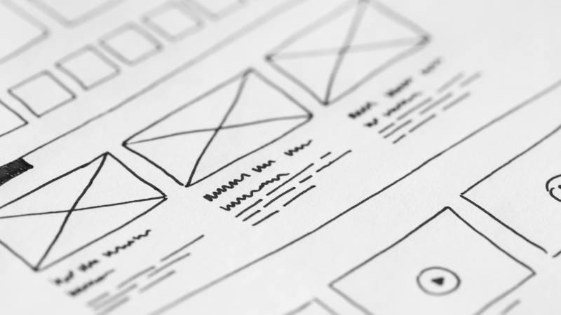Wireframe sketch of a website layout with placeholder text.